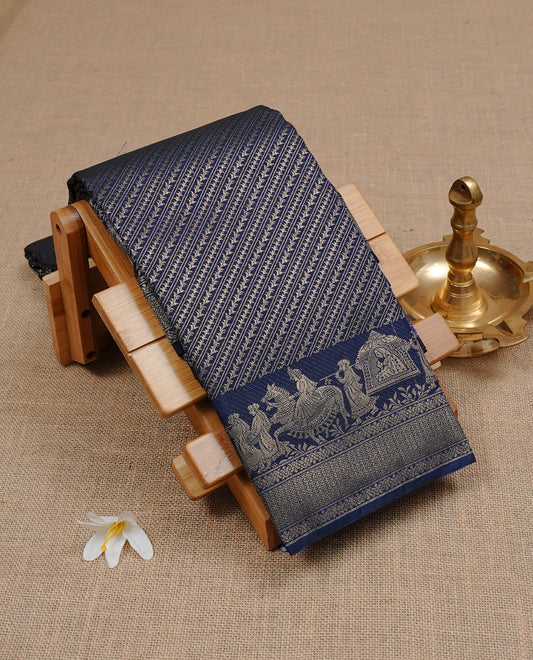 Dark Blue colour Semi wedding silk saree featuring Diagonal stripes on body, enchanced with self colour with gold zari pattern on border, paired with matching blouse piece.