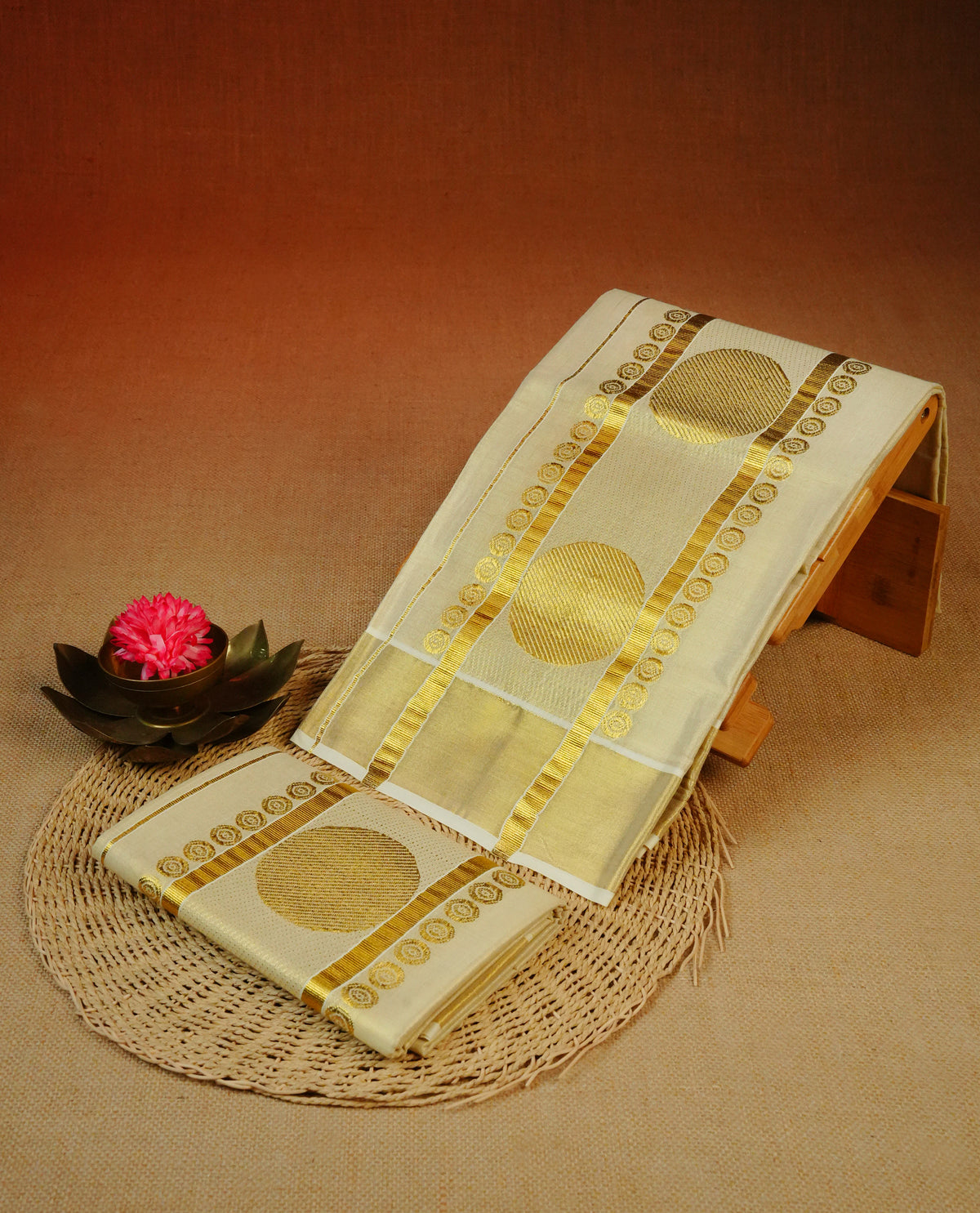 Cream Colour tissue set mundu featuring a plain body, enhanced with elegant Circle  Design on the gold zari kara.