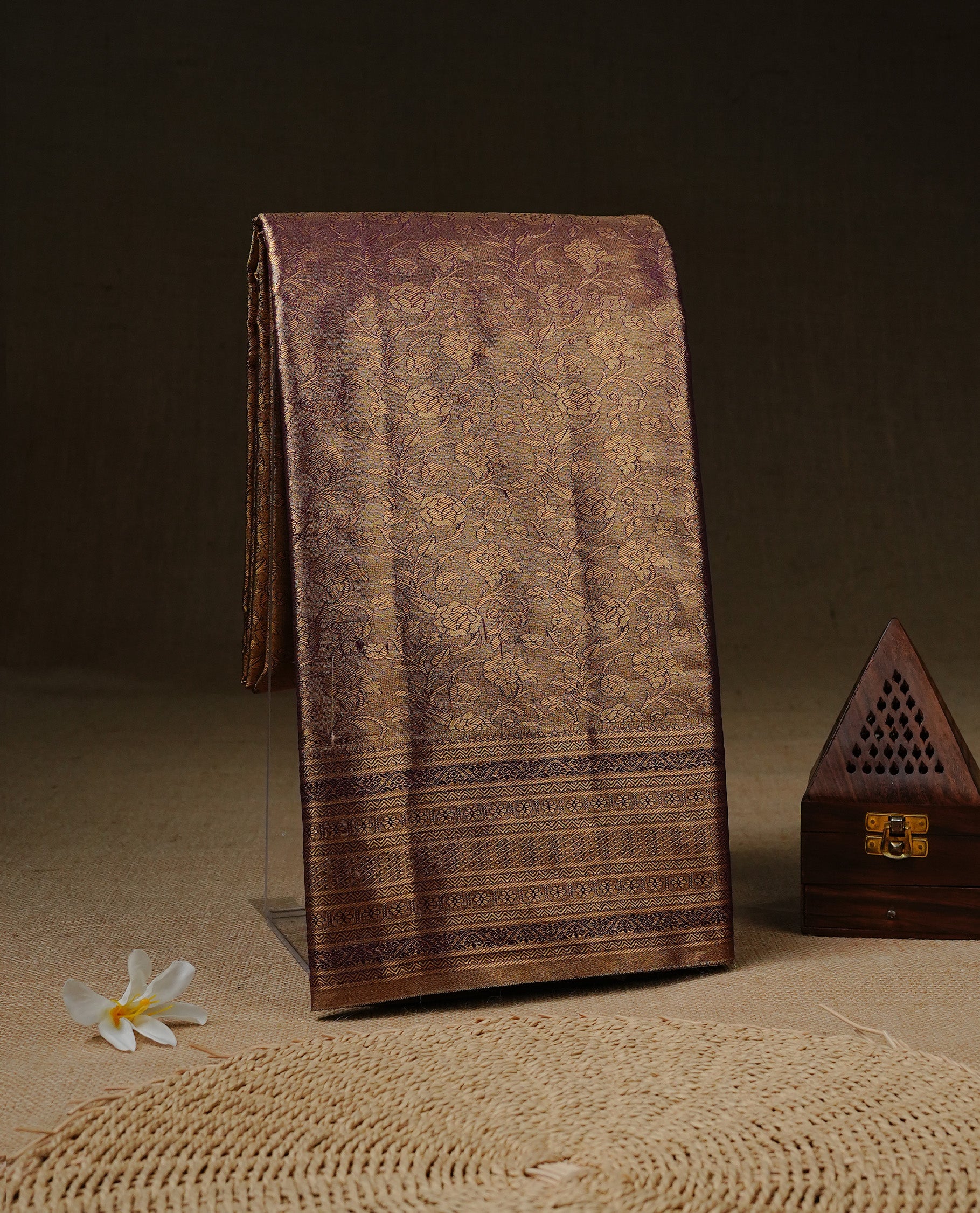 Purple & Gold Colour Tissue silk saree featuirng gold zari kodi pattern on body, enhanced with traditional border on self colour, paired with matching blouse piece.