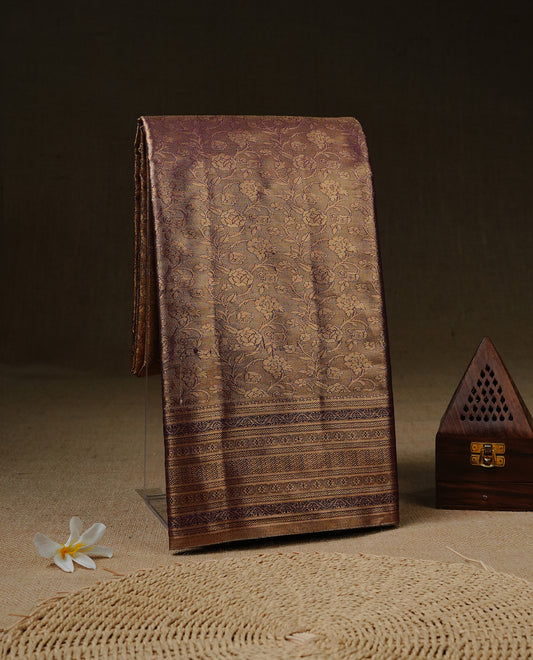 Purple & Gold Colour Tissue silk saree featuirng gold zari kodi pattern on body, enhanced with traditional border on self colour, paired with matching blouse piece.