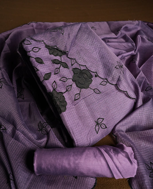 Purple colour churidhar material featuring Black colour thread embroidery on the front panel, self colour dupatta with elegant border, and matching plain bottom