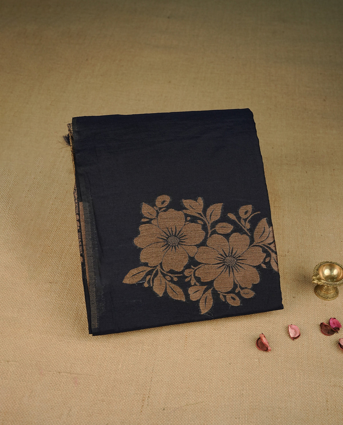 Navy blue colour semi linen saree with elegant gold zari floral motifs across the body, complemented by a contrast colour with grand gold zari pallu and a borderless design, paired with a matching blouse piece.