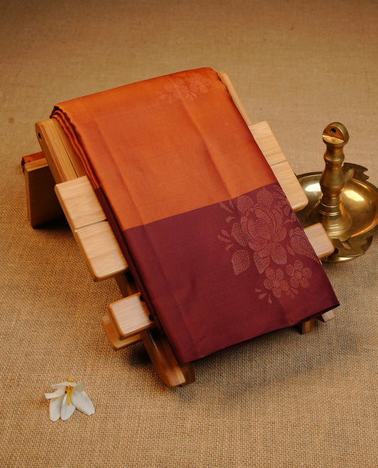 Rust Orange  Colour Traditional Kancheepuram Silk Saree Featuring Copper Zari Floral Motifs on the Body, Designed With a Copper Zari Maroon Border and with a Grand Maroon Pallu, Paired with a Matching Blouse.