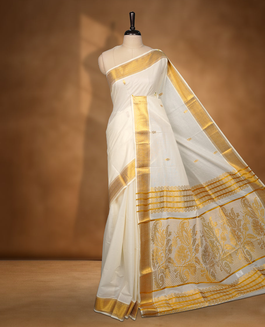 Elegant White colour cotton Kerala saree with gold zari buttas, broad kasavu border, and richly woven traditional pallu, paired with a matching blouse