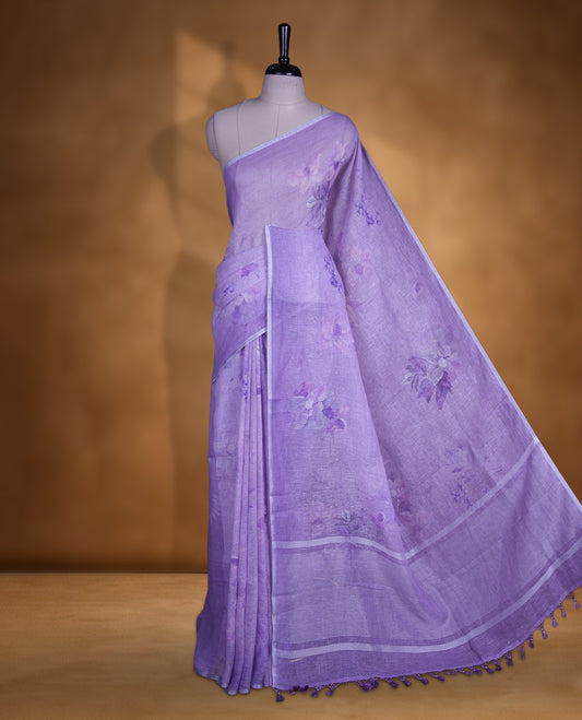 Light purple colour pure linen saree featuring Floral print pattern across body, silver thin border finished with matching blouse.