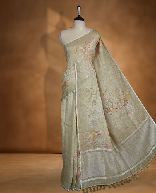 Khaki colour pure linen saree featuring Floral print pattern across body, silver thin border finished with matching blouse.