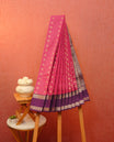 Dark magenta colour soft silk saree featuring gold zari checks with floral mottifs on body, contrast purple colour gold zari traditional border, grand pallu comes with matching blouse piece.
