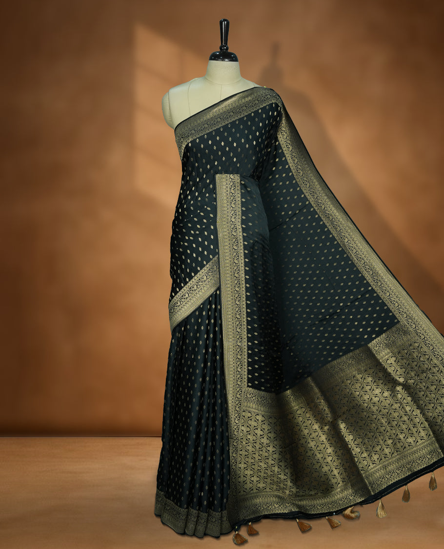 Deep Forest Green Colour Semi Banaras Satin Crepe Saree featuring Gold Zari Woven Small Buti Motifs, Intricately Designed Traditional Banarasi Border, Richly Woven Pallu with Ornate Patterns & Matching Blouse Piece