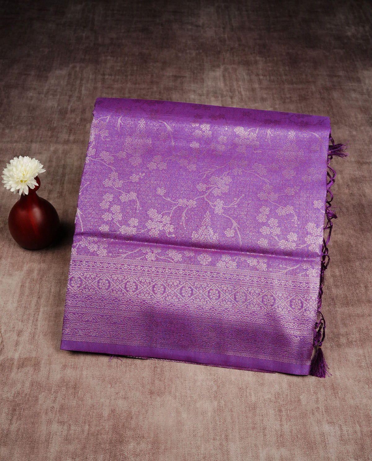 Purple colour softie silk saree featuring silver zari, rich pallu floral pattern brocade body, with contrasting self colour border.paired with matching blouse piece.