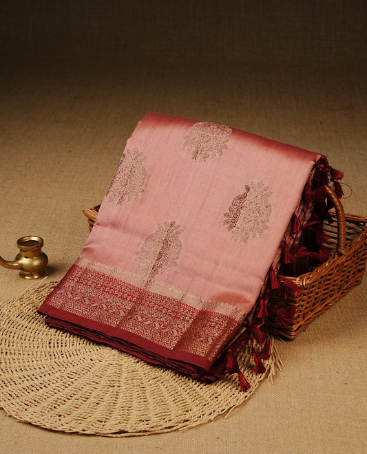 Blush pink  Colour Tussar Silk saree with elegant antique zari floral motifs On Body, a contrasting Maroon zari border, a rich zari pallu, Paired With a matching  blouse piece.