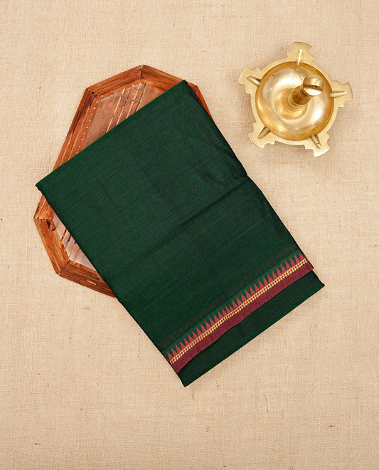 Dark Green colour Narayanapattu cotton saree with a plain body, complemented by a Maroon colour with gold zari and red colour temple designed border & contrast pallu, paired with a matching blouse piece.