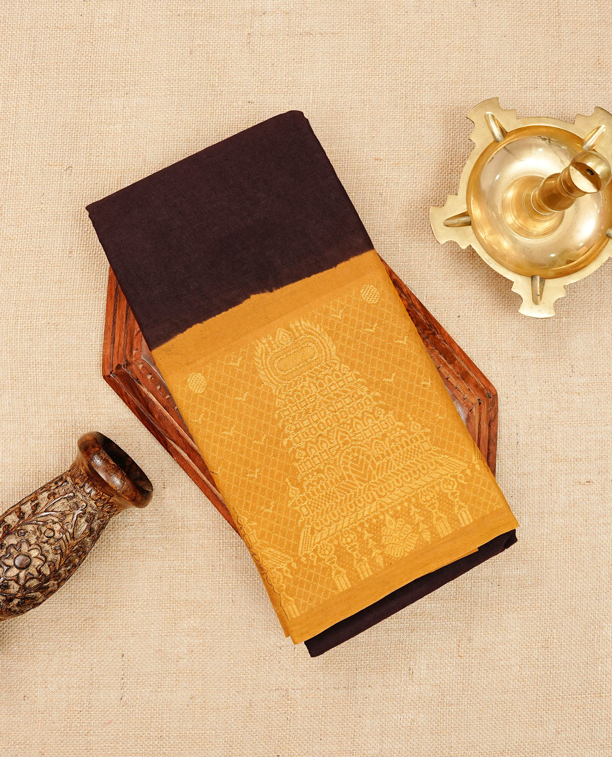 Dark Brown colour Sungudi cotton saree with a plain body, a contrast Mustard with temple zari border & pallu ,paired with a matching blouse piece.