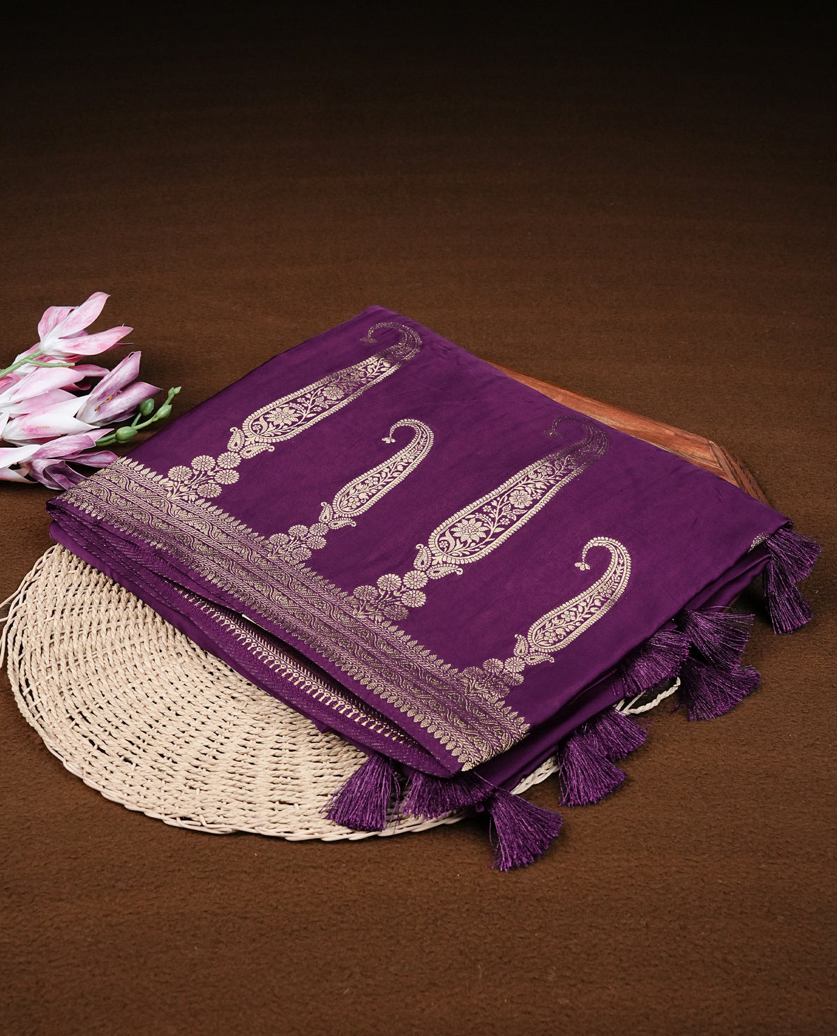 Purple colour Banaras satin crepe silk saree featuring Plain body, associate with Gold zari traditional border, comes with matching blouse piece.