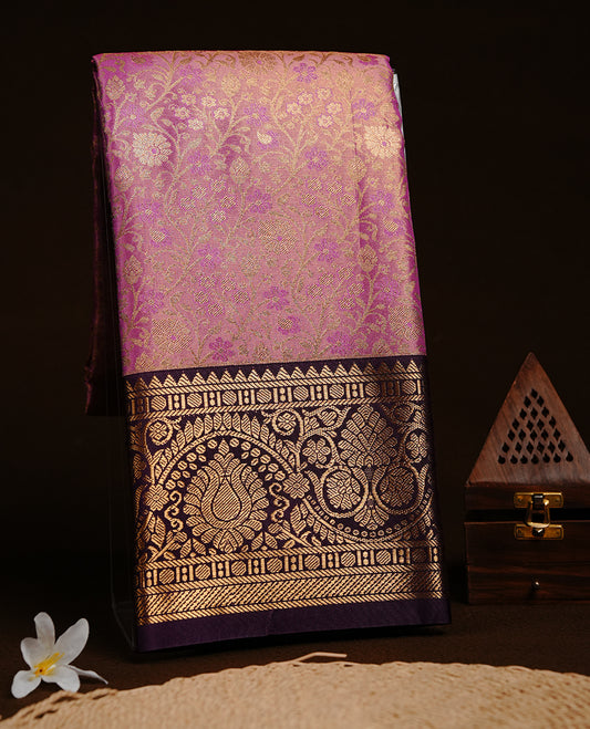 Pink & gold double shade colour semi tissue silk saree featuring gold zari floral kodi pattern on body, contrast purple colour with gold zari traditional border, paired with matching blouse piece.