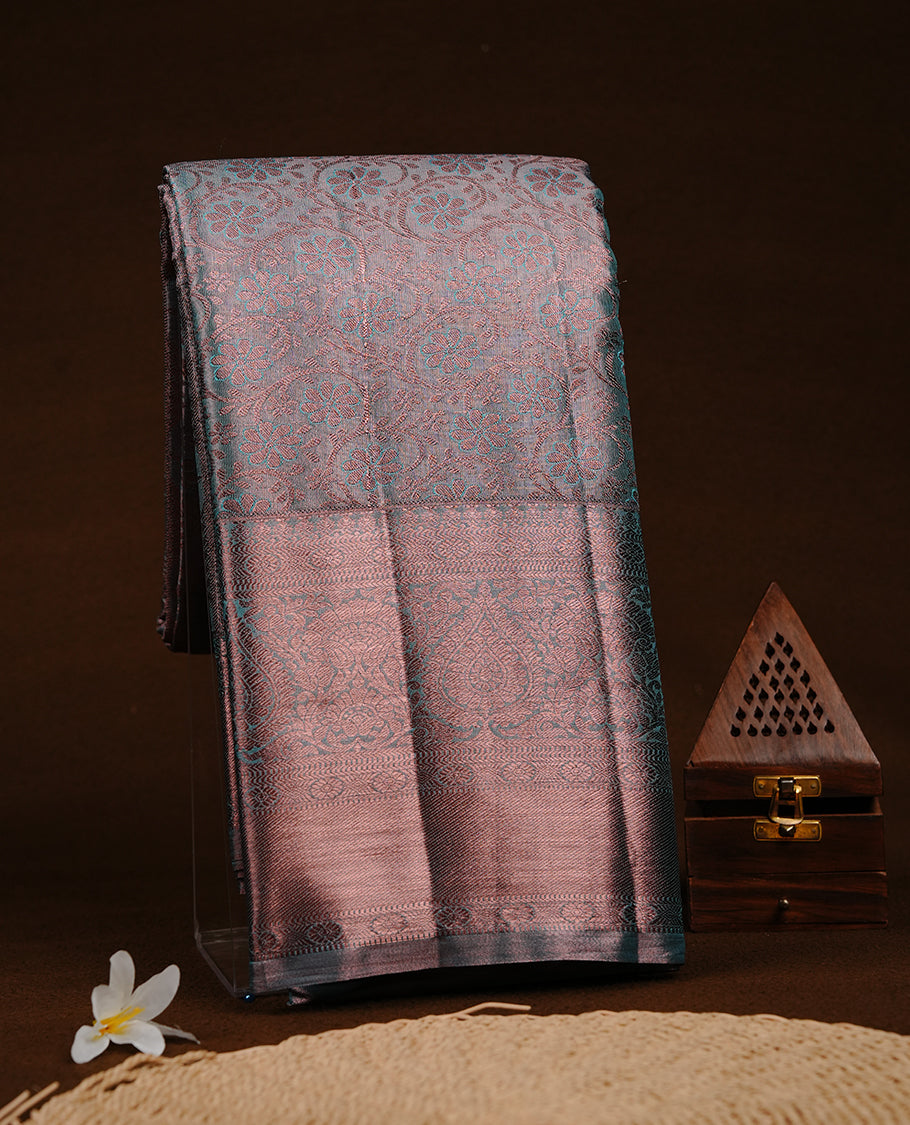 Aqua & copper double shade colour semi tissue silk saree featuring copper zari floral kodi pattern on body, self colour with copper traditional border, paired with matching blouse piece.