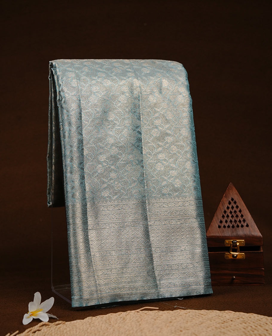 Blue & silver colour semi tissue silk saree featuring silver zari pattern on body, Self colour with silver zari traditional border, paired with matching blouse piece.