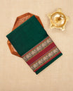 Bottle Green colour Narayanapattu cotton saree with a plain body, complemented by a Maroon Colour with beige colour Elephant designed border & contrast pallu, paired with a matching blouse piece.