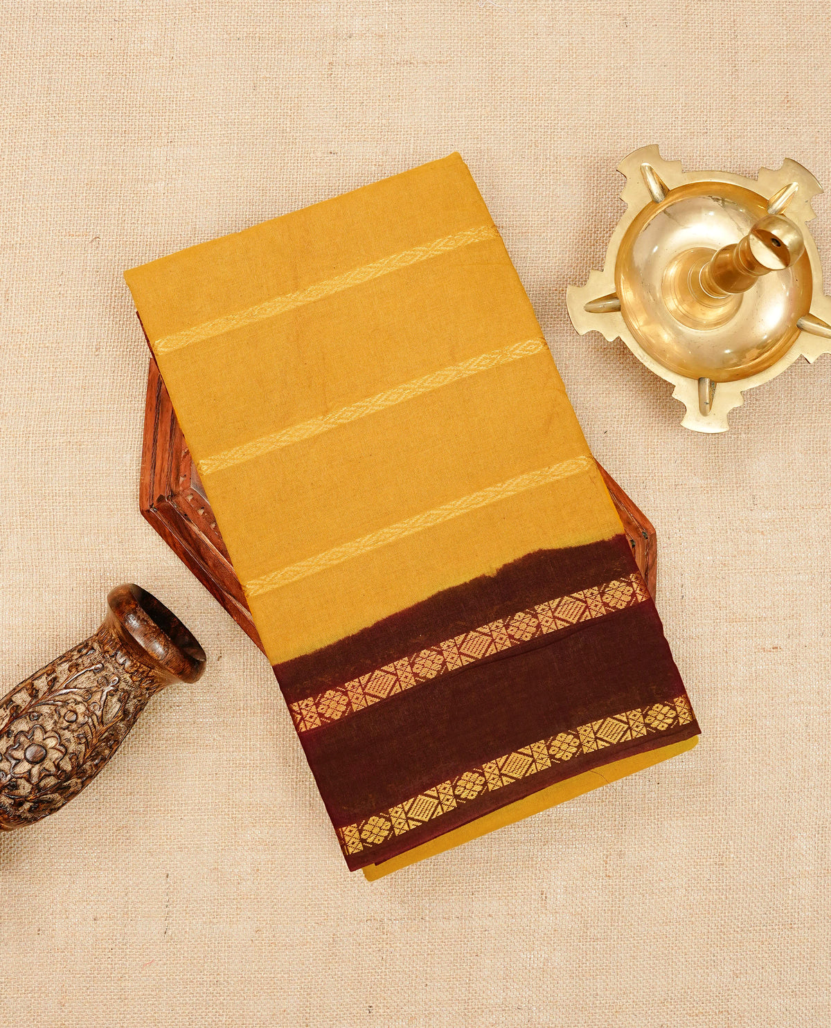 Mustard yellow colour Sungudi cotton saree featuring elegant gold zari stripes on the body, complemented by a contrast Maroon with gold zari border and pallu, paired with a matching blouse piece
