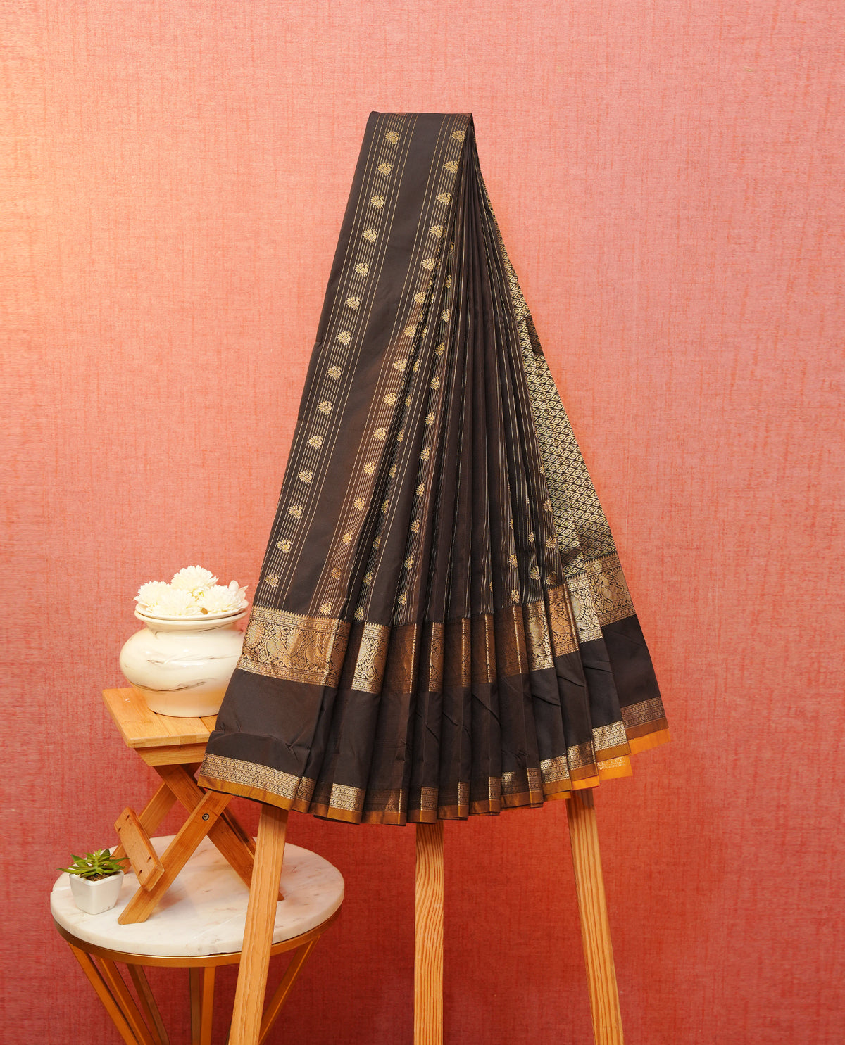 Chocolate colour soft silk saree featuring gold zari stripes & peacock motifs on body, contrast self colour with gold zari  peacock border, grand pallu comes with contrast mustard yellow blouse piece.