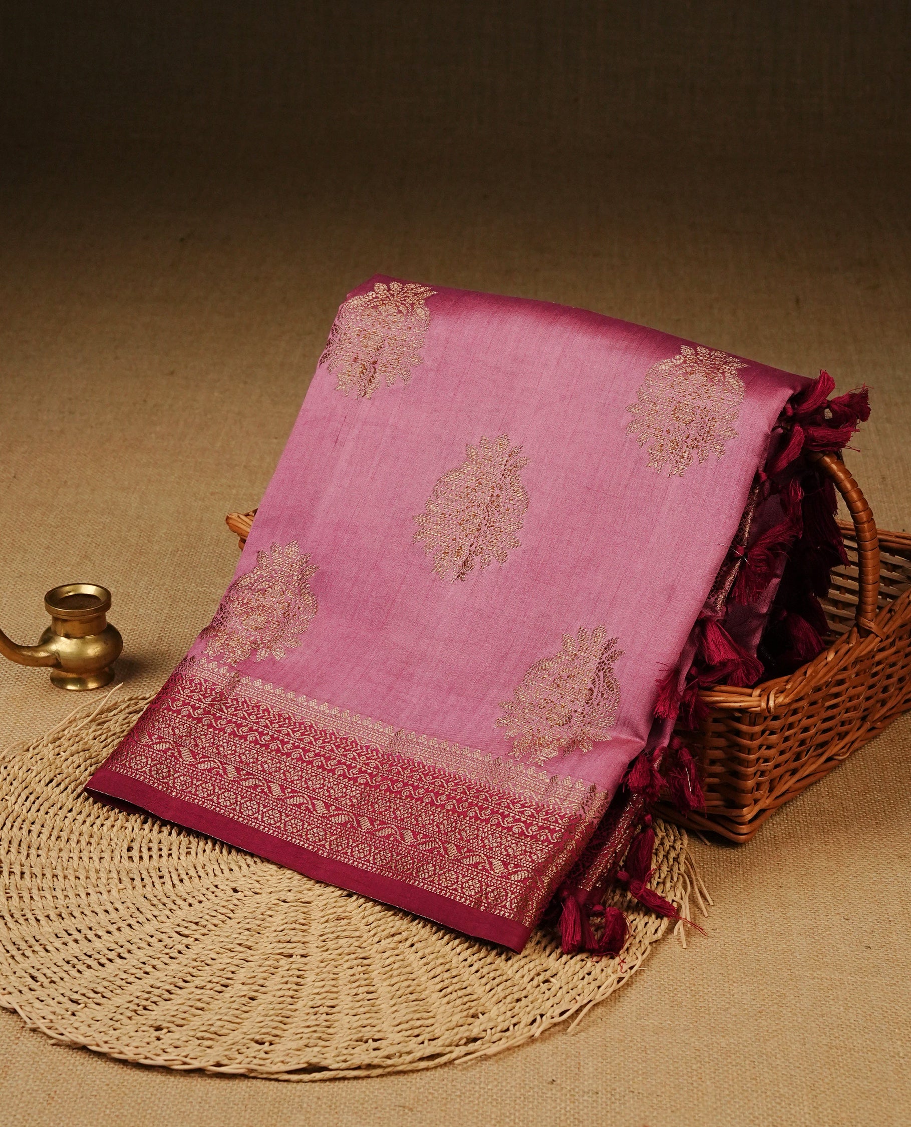 Pastel Orchid Pink Colour Tussar Silk saree with elegant antique zari floral motifs On Body , a contrasting magenta zari border, a rich zari pallu, Paired With a matching blouse piece.