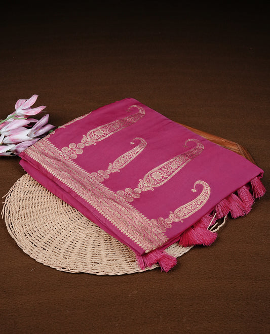 Magenta colour Banaras satin crepe silk saree featuring Plain body, associate with Gold zari traditional border, comes with matching blouse piece.