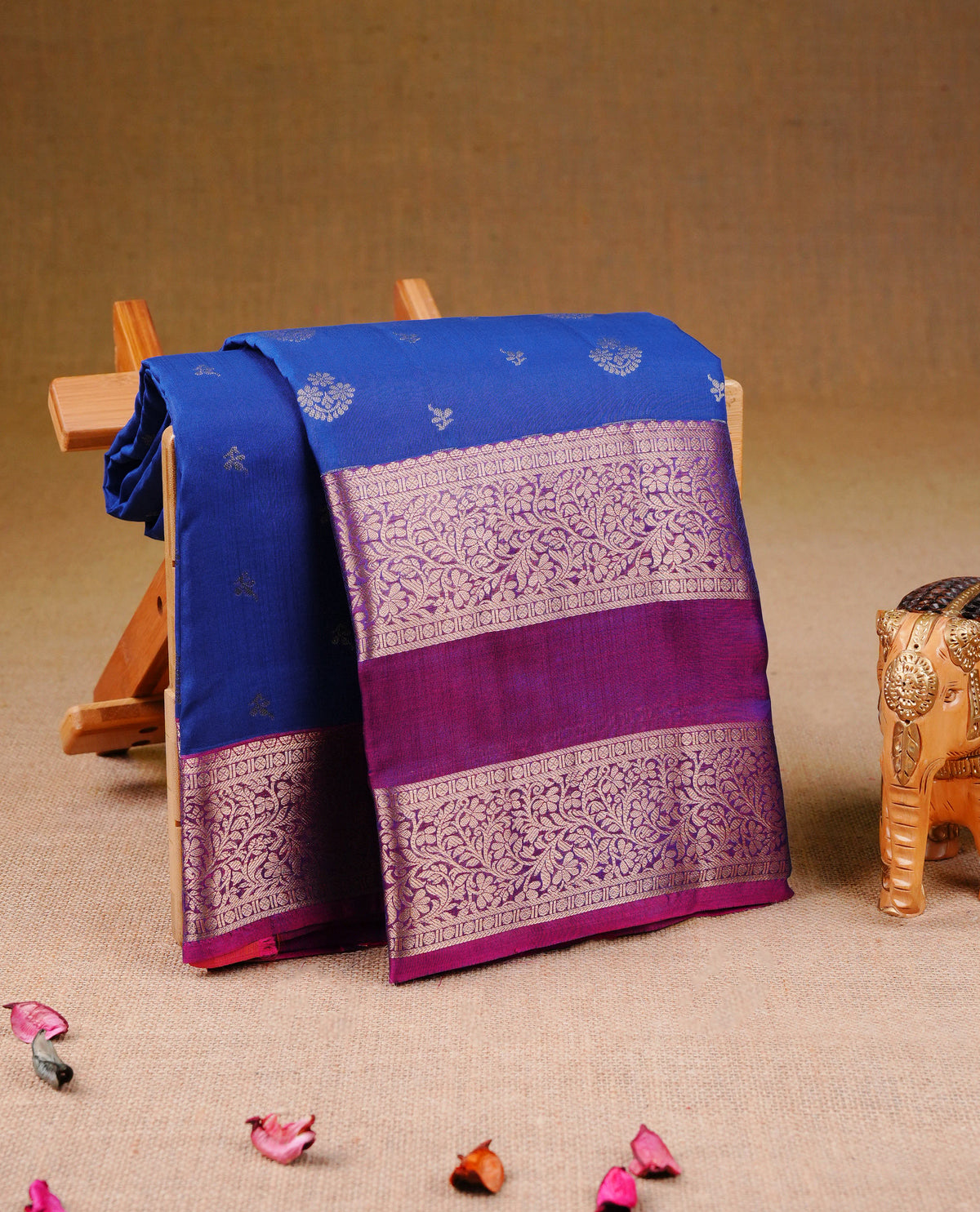 Blue colour Traditional Kancheepuram Silk Saree with Elegant Gold Zari Buttas on the Body, Enhanced with a Contrast Magenta Colour with Gold Zari Border and Rich Pallu, Paired with a Matching Blouse Piece.