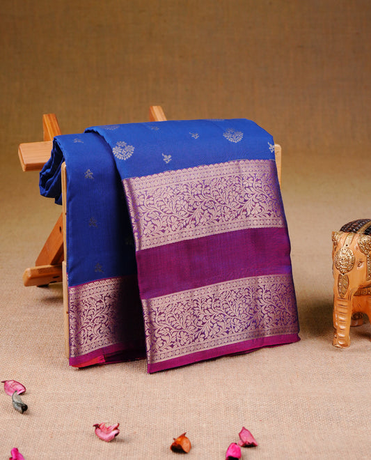 Blue colour Traditional Kancheepuram Silk Saree with Elegant Gold Zari Buttas on the Body, Enhanced with a Contrast Magenta Colour with Gold Zari Border and Rich Pallu, Paired with a Matching Blouse Piece.