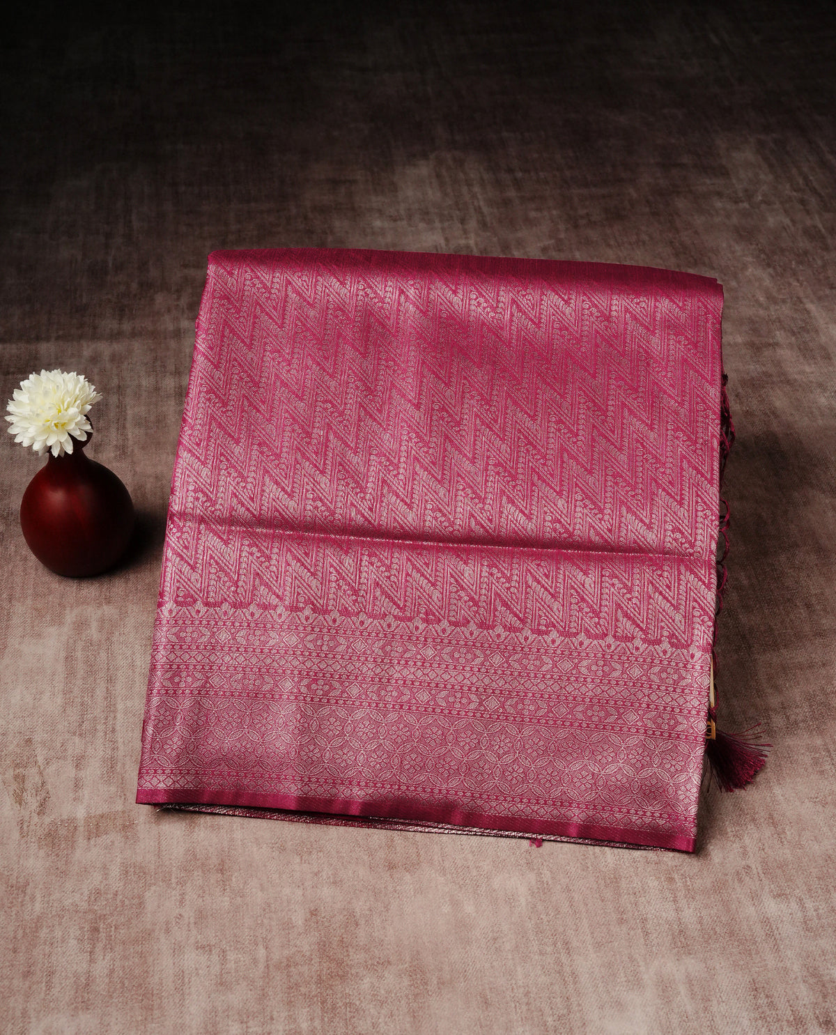 Magenta colour softie silk saree featuring silvar zari, rich pallu floral pattern brocade body, with contrasting self colour patterned border.paired with matching blouse piece.