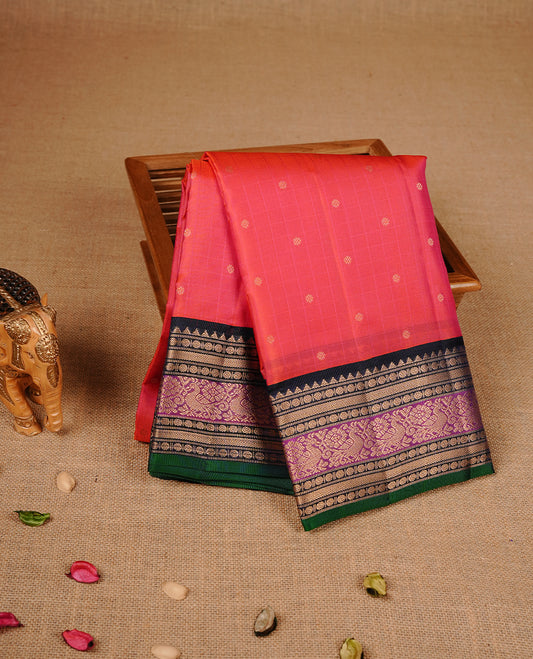 Reddish orange colour traditional kancheepuram silk saree featuring gold zari check pattern on body, complemented by contrast multicolour with gold zari traditional border, paired with matching blouse piece.
