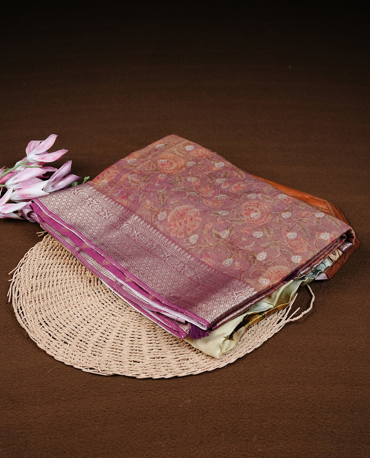 Mauve colour semi Banaras silk saree featuring with Digital printed body and traditional buttas on border, comes with matching blouse piece.