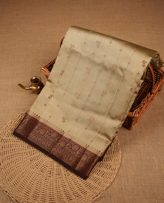 Dark Beige colour Pure banaras soft silk saree featuring Antique zari motifs on body, contrast Chocolate colour border , traditional pallu and paired with matching blouse