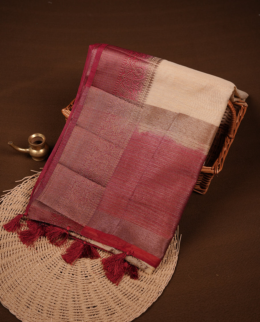 Cream colour semi linen silk saree featuring antique zari motifs on body, traditional border with contrast Deep red colour, pallu and paired with matching blouse