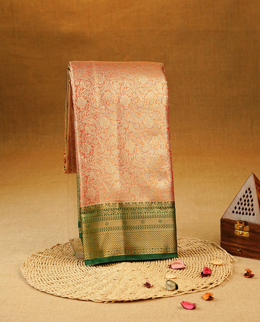 Red colour Semi Tissue Silk Saree featuring gold zari floral kodi Works on the body, complemented by an intricately woven gold zari pallu, a rich Green border with gold zari work and paired with a matching plain blouse piece.
