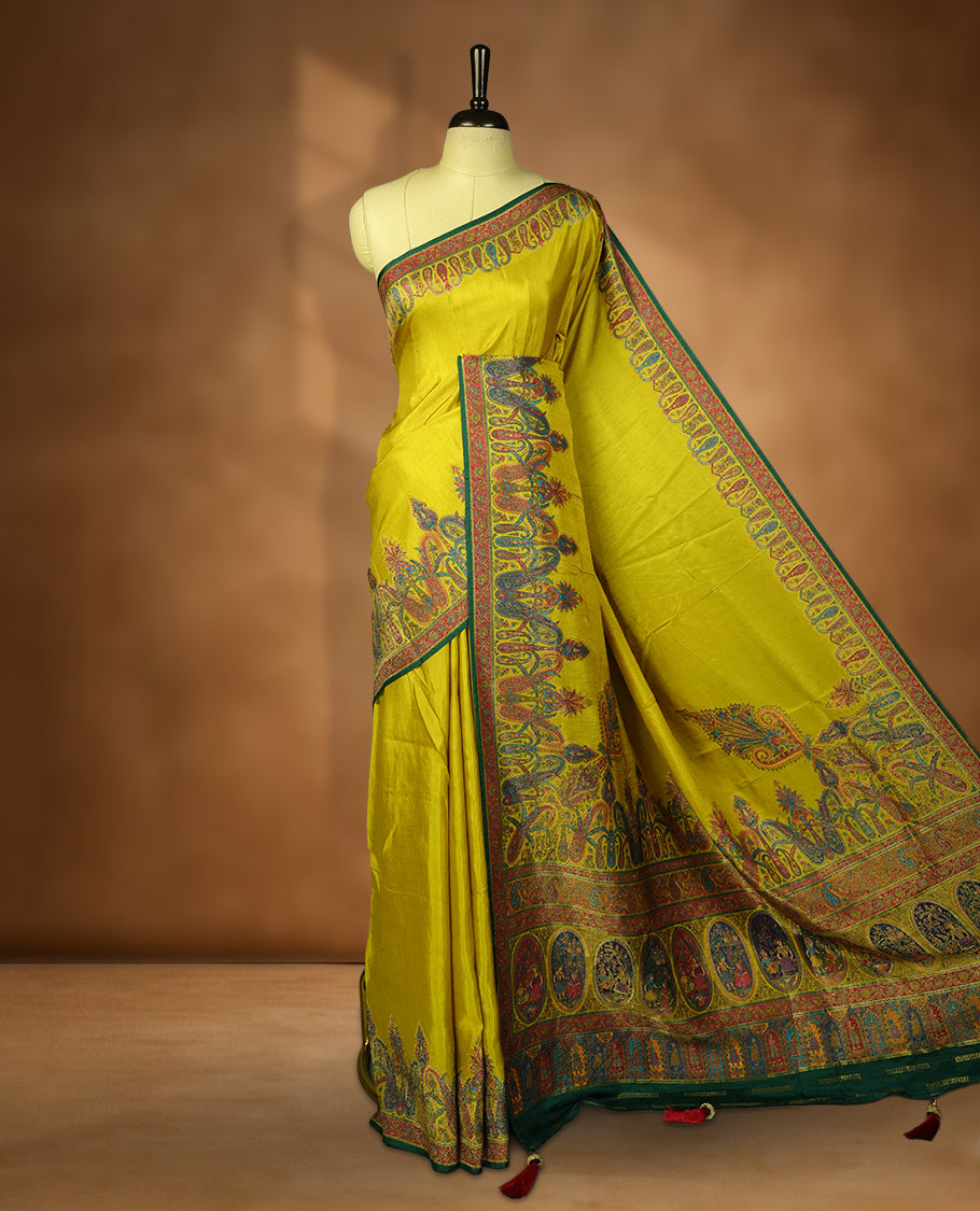 Lemon green colour Pashmina silk saree densely woven with intricate multicolour floral and architectural motifs across the body, framed by an opulent arabesque border and grand storytelling pallu, paired with a matching black woven border blouse piece