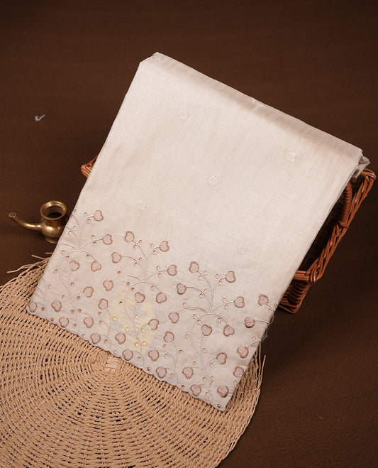 Beige colour Tussar silk saree featuring Elegant plain body, highlighting Brown colour thread floral kodi worked scalp border, pallu and paired with matching blouse piece.