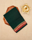 Bottle Green colour Narayanapattu cotton saree with a plain body, complemented by a Red Colour with Gold zari & beige colour temple designed border & contrast pallu, paired with a matching blouse piece.