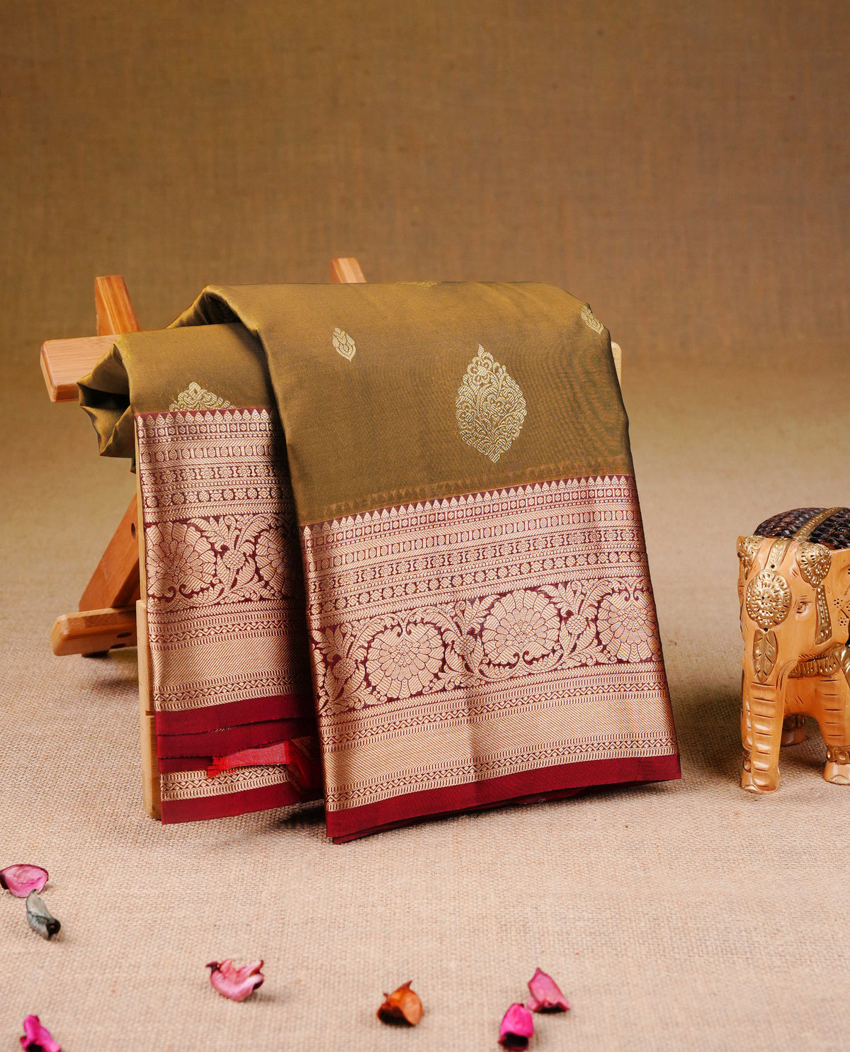 Mustard Olive Colour Traditional Kancheepuram Silk Saree with Elegant Gold Zari Buttas on the Body, Enhanced with a Contrast Maroon Colour  with Gold Zari Floral Border and Pallu, Paired with a Matching Blouse Piece.