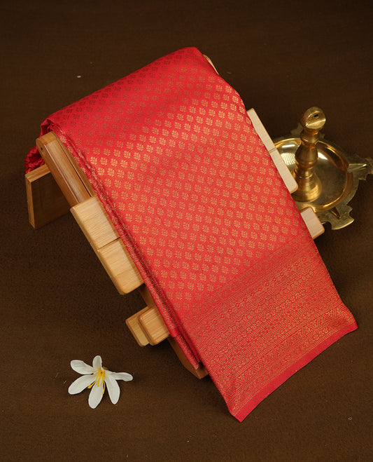 Red colour semi soft silk saree featuring gold zari motifs on across body, self colour border with traditional gold zari pattern, pallu and paired with matching blouse.