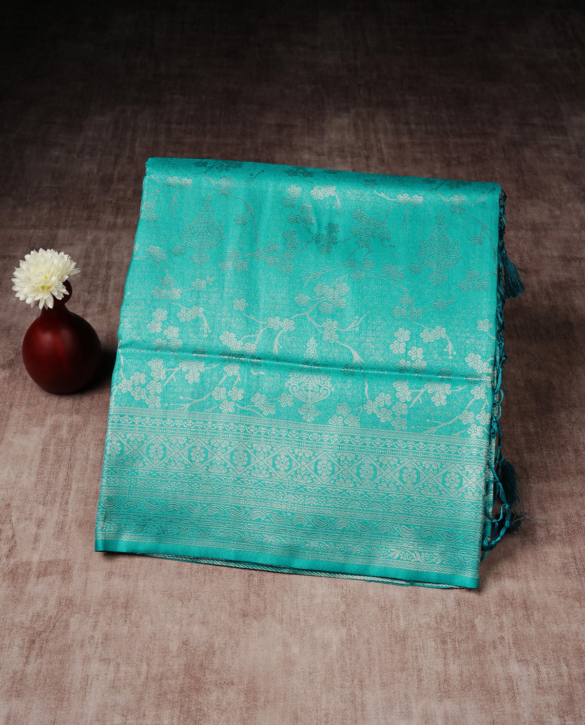 Aqua blue colour softie silk saree featuring silvar zari, rich pallu floral pattern brocade body, with contrasting self colour border.paired with matching blouse piece.