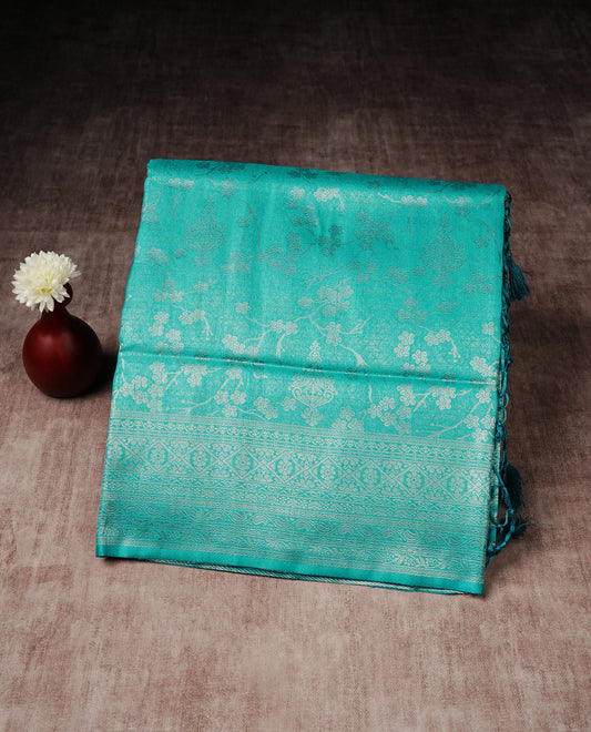 Aqua blue colour softie silk saree featuring silvar zari, rich pallu floral pattern brocade body, with contrasting self colour border.paired with matching blouse piece.