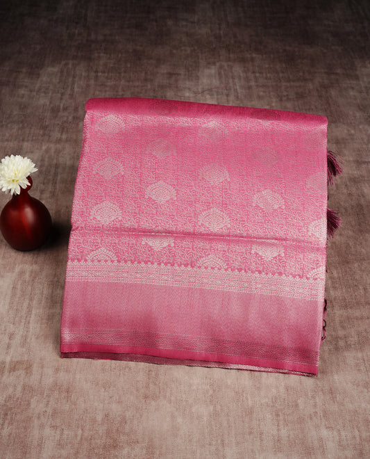 Magenta colour softie silk saree featuring silver zari, rich pallu floral brocade body, with contrasting self colour border.paired with matching blouse piece.
