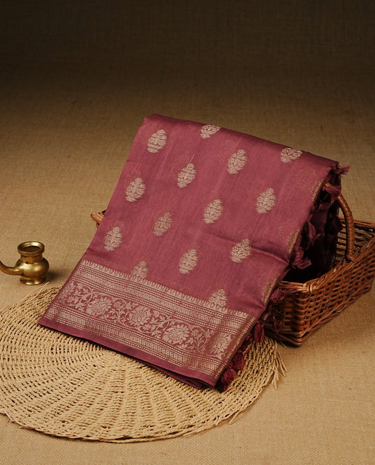 Pastel Onion Colour Tussar Silk saree with antique zari butta motifs On Body, a self-toned floral zari border, a rich zari pallu, and a matching blouse piece.