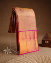 Gold & magenta double shade colour kancheepuram tissue silk saree featuring gold zari pattern across body, complemented by contrast magenta colour border traditional zari border, paired with matching blouse piece.