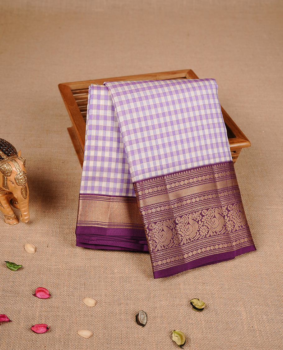 Lavender & Purple colour traditional kancheepuram silk saree featuring gold zari check pattern on body, complemented by contrast purple colour with gold zari traditional border, paired with matching blouse piece.