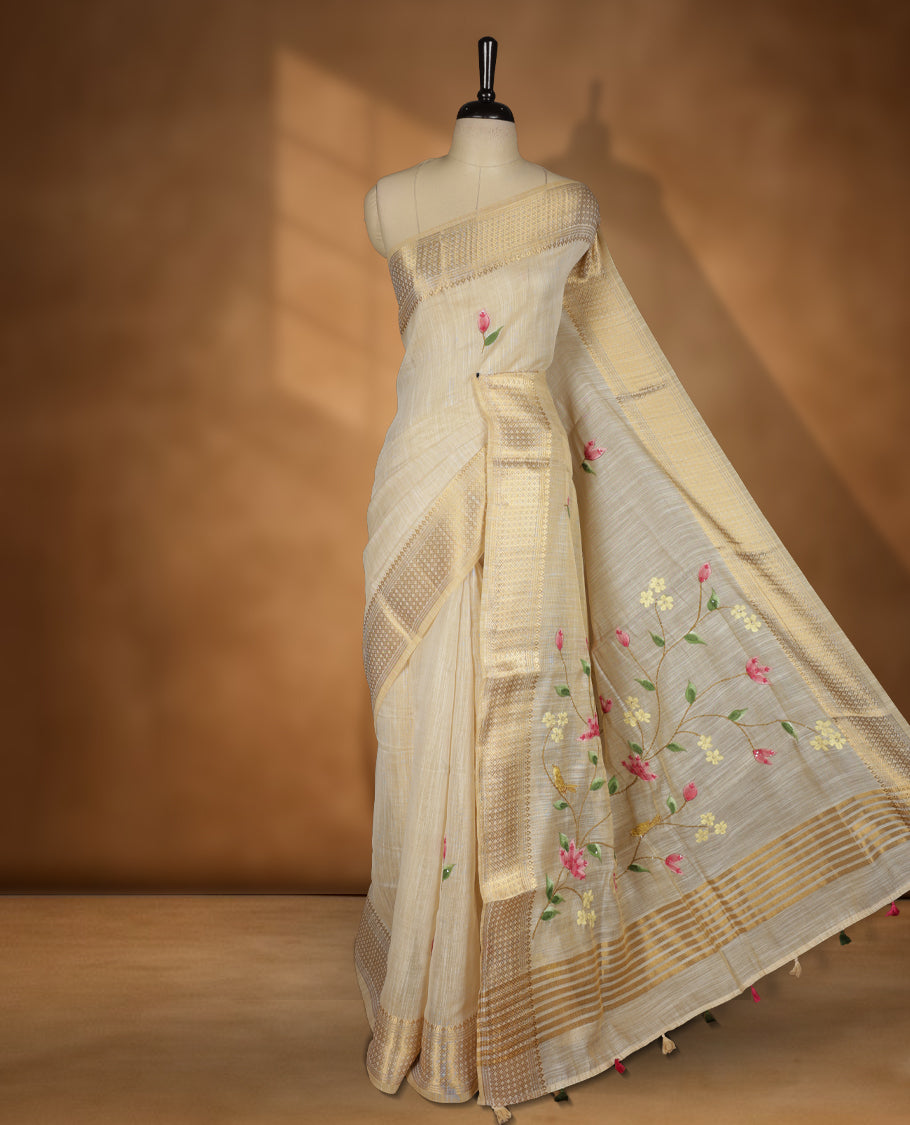 Beige colour Banarasi linen silk saree featuring hand brushed colour with Floral  & birds printed pattern on body, gold zari woven geometric design border with self colour pallu and comes with a matching blouse