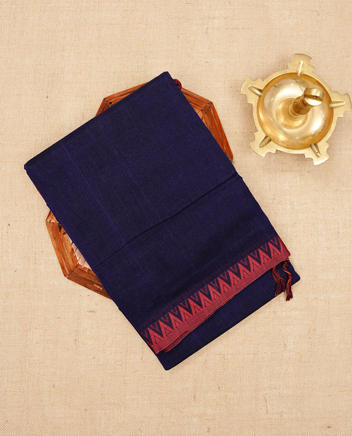 Deep purple colour Narayanapattu cotton saree with a plain body, complemented by a Maroon Colour with Red Colour Temple designed border & contrast pallu, paired with a matching blouse piece.