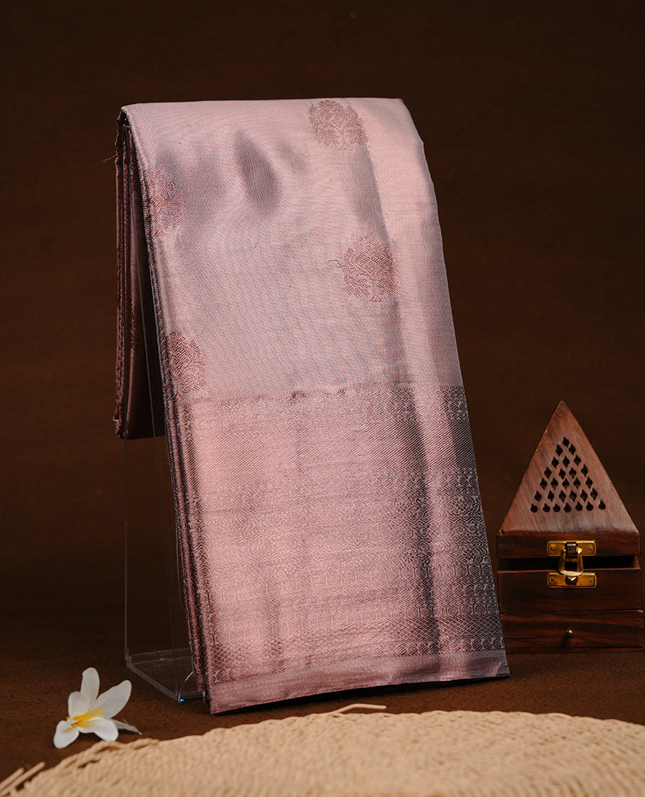 Copper colour semi tissue silk saree featuring copper zari pattern on body, selfcolour with gold zari traditional border, paired with matching blouse piece.