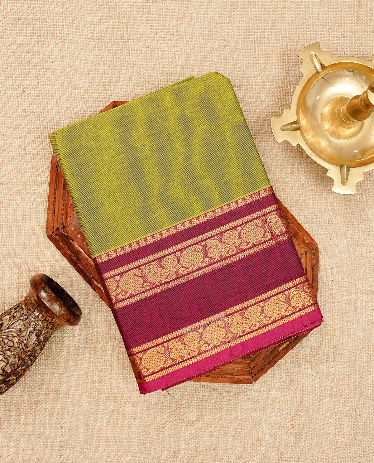 Olive green colour chettinad cotton saree featuring elegant plain body, Contrast magenta colour with Gold zari border, comes with matching blouse piece.
