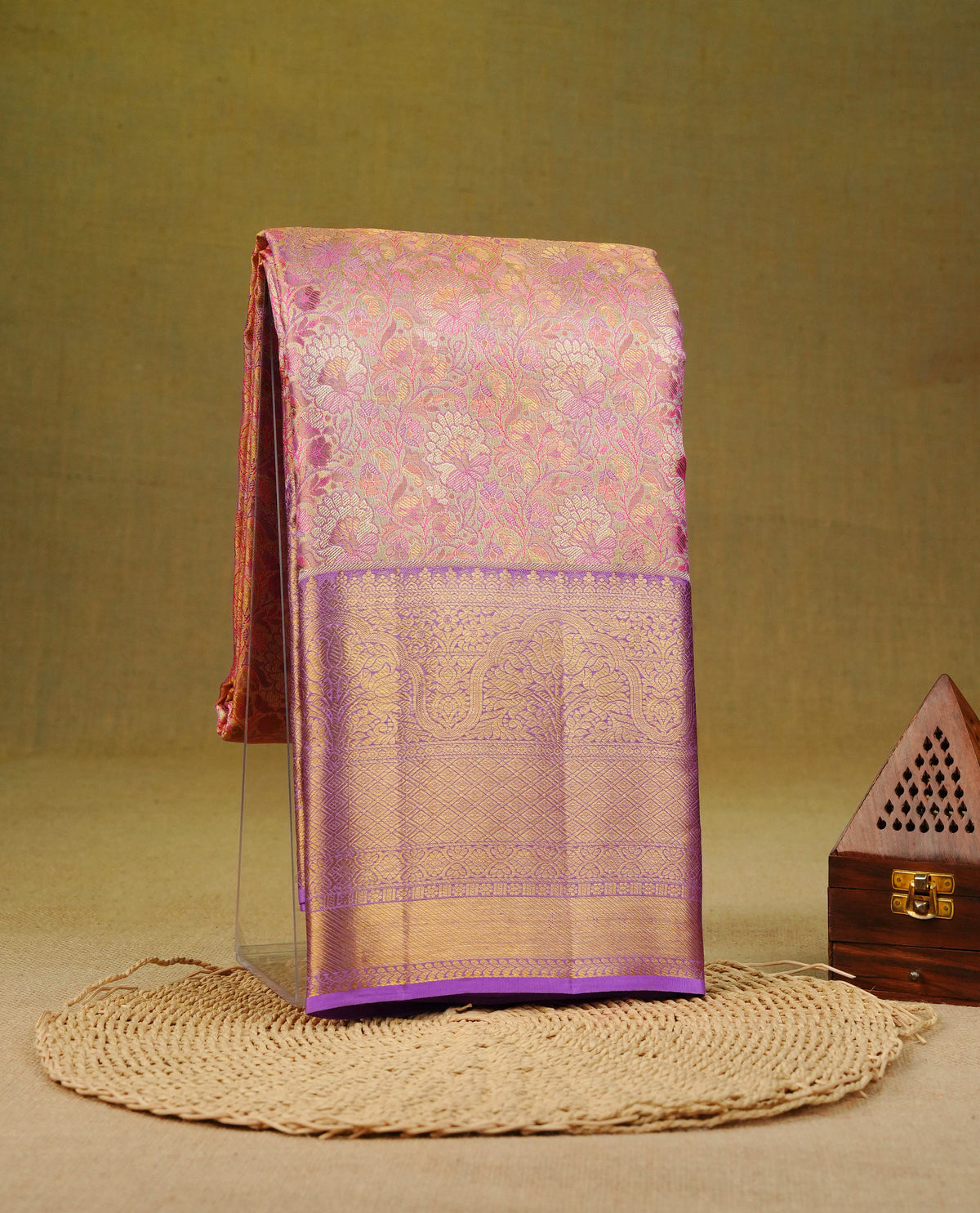 Light gold & lavender colour pure tissue silk saree featuring multi colour zari floral kodi pattern on body, complemented by contrast Lavender colour traditional border, comes with matching blouse piece.