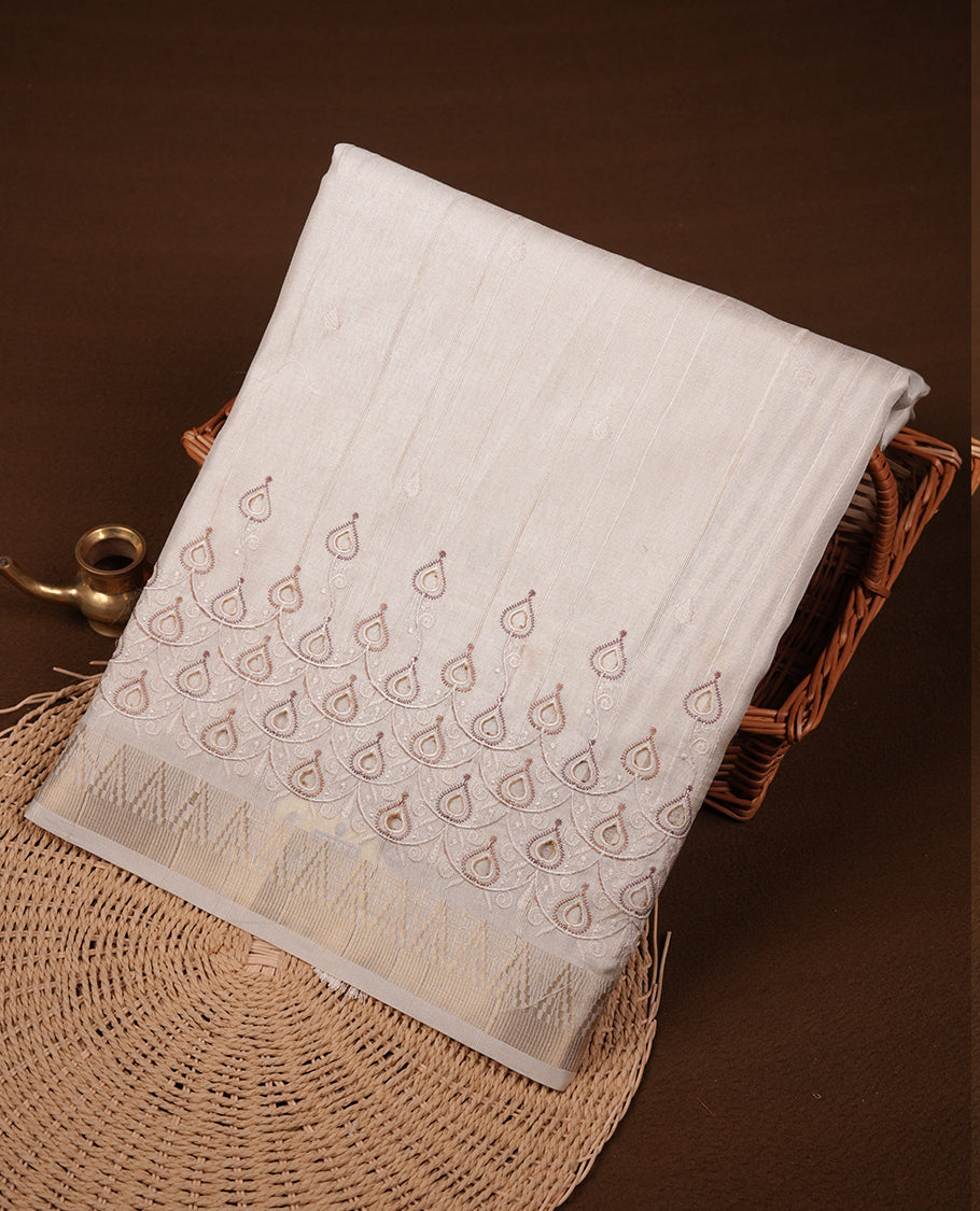 Beige colour Tussar silk saree featuring Elegant plain body, highlighting Brown colour cut work with Light gold zari border, pallu and paired with matching blouse piece.